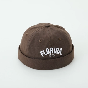 Detail of dark brown docker hat featuring white Florida 1845 embroidery on cotton canvas