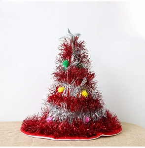 Luminous red Christmas tree hat with silver tinsel and colorful pom poms for festive parties