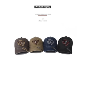 Detailed close-up of TEXAS embroidery and bull skull pattern on washed cotton baseball caps