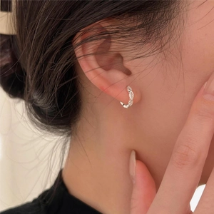 Close-up of S925 sterling silver hoop earrings with marquise-cut zircon on ear