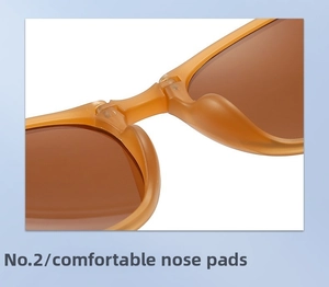 Close-up of comfortable amber resin nose pads on lightweight folding sunglasses