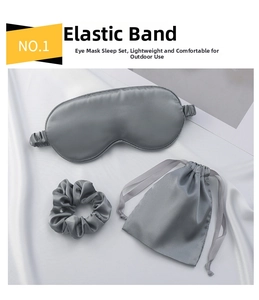 Detail of silk sleeping set showing elastic eye mask, scrunchie and drawstring pouch