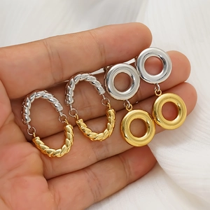 Chic two-tone gold and silver twisted oval and interlinked hoop earrings for women