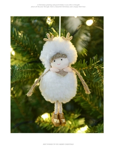 Plush Christmas elf angel hanging ornament with gold accents on a festive tree branch