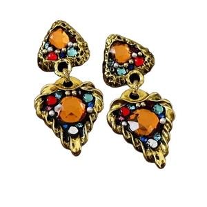 Vintage gold plated earrings featuring heart pearls and colorful gemstone accents