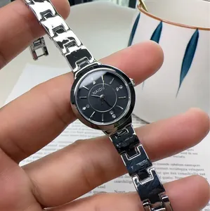 Elegant NAIDU silver stainless steel women watch with black rhinestone dial on wrist