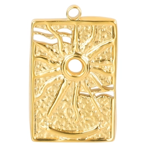 Macro shot of rectangular gold sunburst pendant with crescent detail on white background