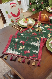 Detail of Christmas table runner featuring jacquard reindeer and snowflake patterns with tassels