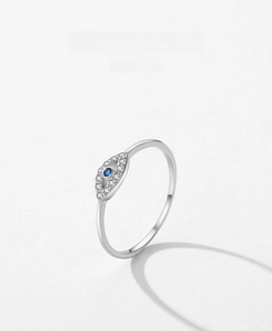 Detailed close-up of S925 sterling silver evil eye ring with blue stone and white pavé zircons