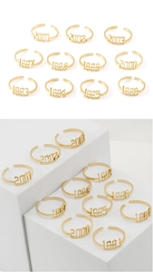 Detailed arrangement of 18K gold stainless steel birth year rings from 1993 to 2003
