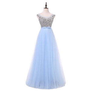 Close-up of the light blue evening dress featuring sequin bodice and bow waistband