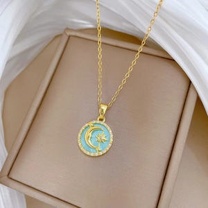 Titanium steel gold necklace featuring a turquoise moon and star pendant with crystal halo
