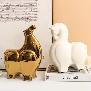 Minimalist abstract ceramic horse figurines in electroplated gold and matte white finishes