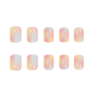 Short square press-on nails with pastel pink, yellow, and blue gradient marble finish