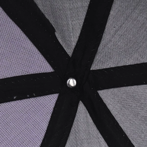 Detailed macro view of cotton baseball cap interior showing grey fabric and black reinforced tapes