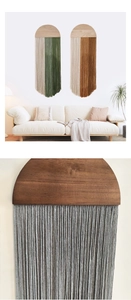 Detail of bohemian woven wall hanging with natural wood grain and dual-tone cotton tassels