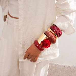 Retro resin bangles set with bold marble texture and large red fabric rose detail