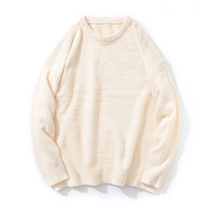 Close-up detail of cream white knitted sweater fabric with soft fuzzy texture and crew neck