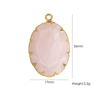 Detailed view of an oval pink natural stone pendant with gold bezel including size specs