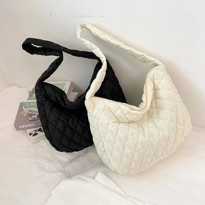 Quilted oversized shoulder bag in black and white styles with soft cloud padding texture