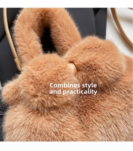 Macro shot of caramel faux fur texture on a plush bucket bag with leather strap detail