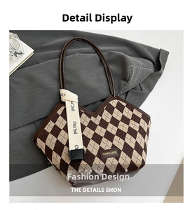Detail of checkered tote bag with V-shaped opening and decorative ribbon accent