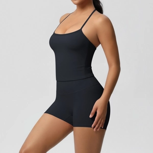 Close-up of black double-sided brushed yoga set with thin straps and open back detail