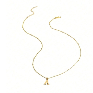 Detail of a minimalist gold satellite chain necklace featuring a capital letter A pendant