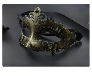Detailed close-up of a bronze vintage Roman masquerade mask with ornate textures