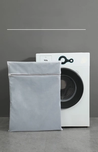 Close-up of a thickened fine mesh laundry bag with a durable gray zipper closure