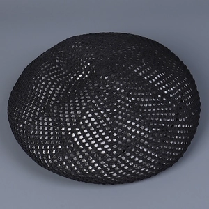 Close-up of the black hollow knit texture on this breathable beret for women