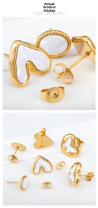 Detail of golden stainless steel stud earrings with white shell heart and oval inlays