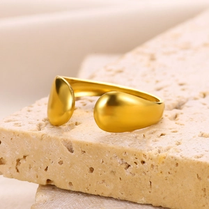 Macro shot of 18k gold plated stainless steel irregular tear-shaped open ring detail