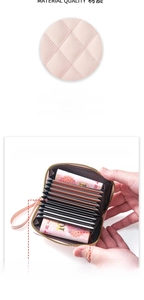 Macro view of pink quilted rhombus pattern and organ-style multi-card slots design
