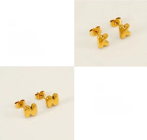 Detail of 18K gold plated titanium steel bubble letter earrings with polished finish