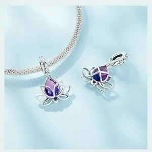 Macro detail of S925 sterling silver lotus charm with purple and blue gradient zircon