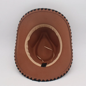 Detail view of brown cowboy hat interior with sweatband, drawstring and material label