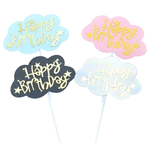 Set of four colorful cloud Happy Birthday cake toppers in pink black blue and white