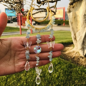 Golden suncatcher with natural light blue crystal stones and butterfly crystal prisms