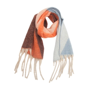Close-up of thick knitted scarf with orange and blue jacquard patterns and chunky tassels