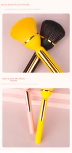 Detail view of pink powder brush with golden spiral ferrule and premium ABS plastic handle