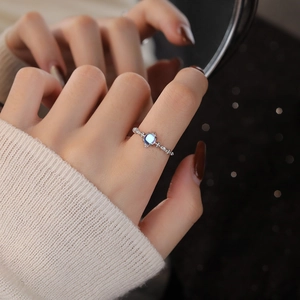 Elegant S925 sterling silver moonstone ring with twisted band on a finger