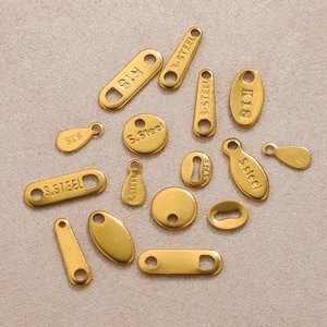 Assorted gold stainless steel jewelry tags and connectors for DIY bracelet making