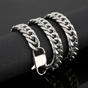 Close-up of polished silver titanium steel Cuban link chain with sturdy lobster clasp