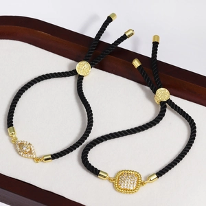 Adjustable black cord bracelets with gold micro-pave evil eye and square zircon charms