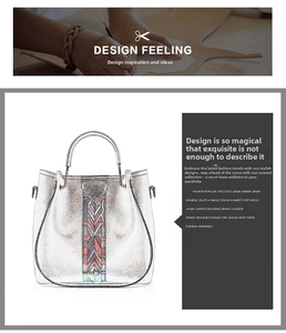 Detail view of silver metallic tote bag featuring colorful geometric embroidery on the front