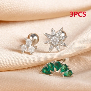 Macro shot of 3pcs silver stainless steel stud earrings with clover and star-shaped zircon