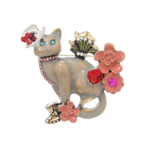 Vintage enamel cat brooch with floral accents and sparkling rhinestones for suits