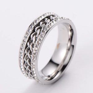 Macro shot of silver twisted chain ring featuring double rows of sparkling rhinestones