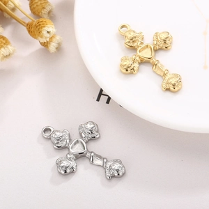 Detailed macro view of gold and silver stainless steel cross pendants with flower accents